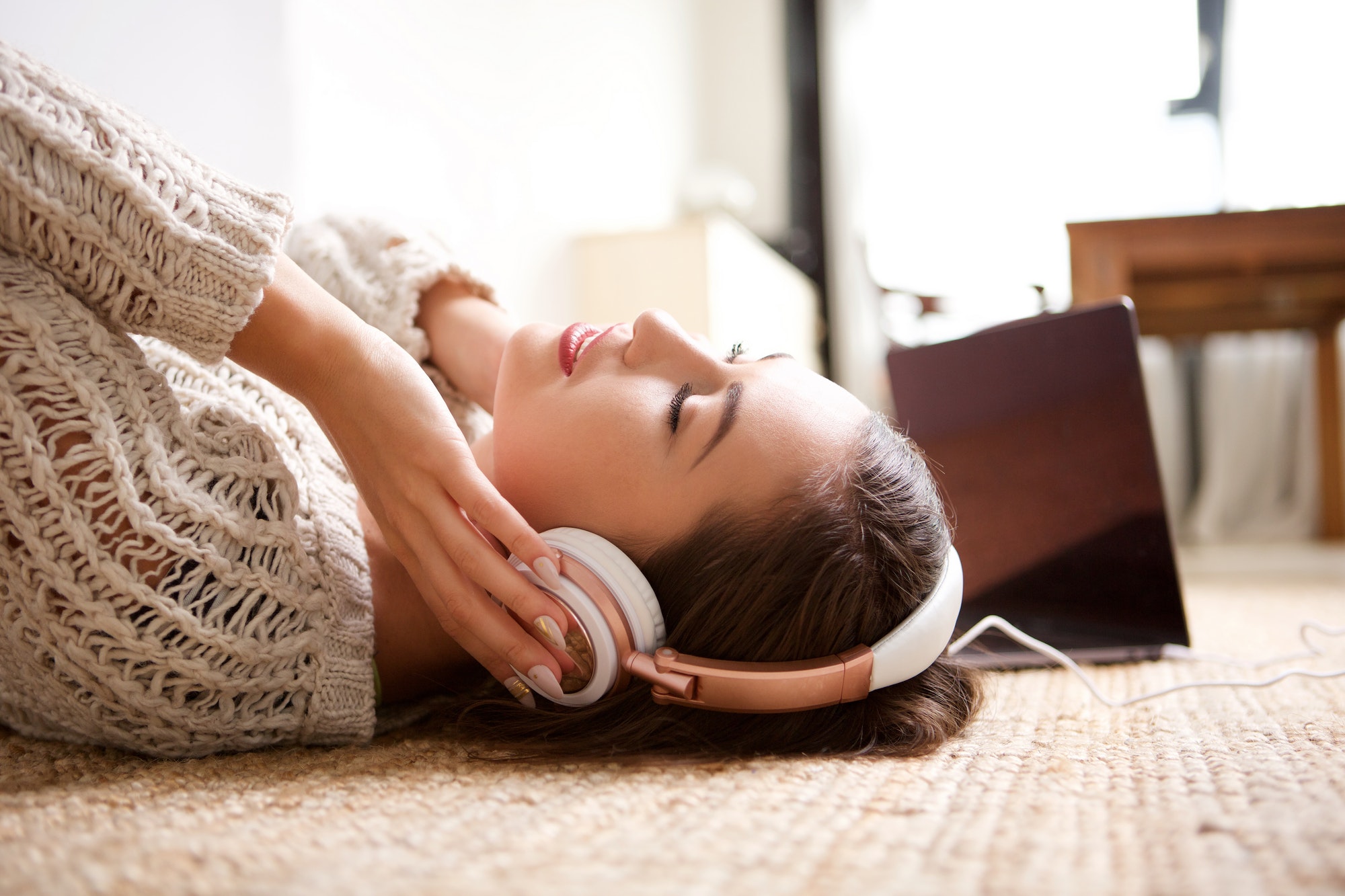 young woman sleeping with headphones
